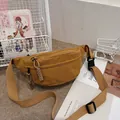 Minimalist ginger yellow corduroy waist bag with textured fabric and woven zippers - Yellow