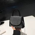 Elegant black suede mini bag with shimmering silver rhinestones and metal chain strap - Black