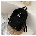 Classic black corduroy backpack for women with decorative pins and student casual style - Black