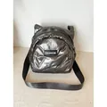 Quilted silver gray crossbody bag in padded puffer fabric with fashion label - Gray