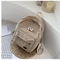 Beige corduroy backpack with cute cartoon face design for students and casual use - Khaki