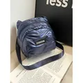 Navy blue glossy quilted puffer crossbody bag with Fashion label and fabric strap - Blue