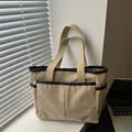 Beige corduroy tote bag with blue trim and large front pockets for daily commuting - Khaki