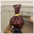 Minimalist vintage pleated bucket bag in deep burgundy with gold ring and knot handle - Burgundy