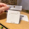 Minimalistische transparente Silikon-Ohrstopper mit S925-Silberstiften auf Display-Karte - OPP Beutel