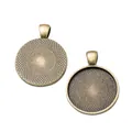 Macro detail of round vintage bronze alloy pendant trays with inner woven mesh texture - Antique Bronze