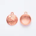 Detailed close-up of rose gold alloy globe charms showing 3D world map and textured back - Rose Gold