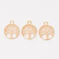 Detailopname van drie roségoudkleurige levensboomhangers van zinklegering voor DIY-sieraden - KC Goud