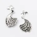 Pair of vintage zinc alloy peacock charms with detailed feather texture for DIY jewelry - Antique Silver