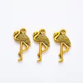 Three vintage gold flamingo pendants with feather texture for DIY jewelry making - Antique Gold