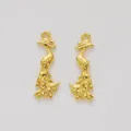 Macro detail of pair golden peacock alloy pendants with fine textures for DIY jewelry - Gold