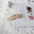 Elegant beige plush hair clip in a soft faux rabbit fur finish for winter styling - Off White