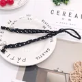 Polka dot hair tie with elegant white pearls on a high-elastic black chiffon band - Black with White Polka Dots