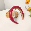 Detailed close-up of red PU leather padded headband with anti-slip inner fabric lining - Red