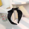 Elegant black satin fabric headband featuring a wide knotted bow for women's hair styling - Black