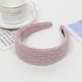 Close-up of pink knit headband with thick texture and non-slip inner teeth detail - Pink