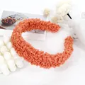 Close-up of orange plush lamb wool headband with soft texture and stylish wide brim - Bean Paste Red