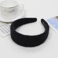 Handmade wide black knitted headband with a soft plush texture for a cozy winter style - Black