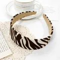 Detail of zebra print wide headband featuring retro animal pattern on soft fabric - Zebra Brown Headband