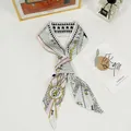 Detail of silk twilly hair scarf with bee and star patterns and Paris lettering - Double Sided Tarot-Goddess