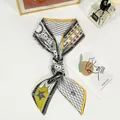 Detail of silk-like Twilly scarf with tarot bee print and French text in frame - Double Sided Tarot-World