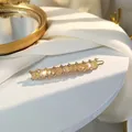 Elegant gold alloy hair clip with yellow crystals and diamonds on white surface - Beige