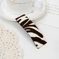 Rectangular hair clip featuring a brown and cream zebra print fabric finish - Zebra Brown Clip