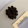 Detail of a thick dark brown plush scrunchie with soft fuzzy texture on a beige background - Dark Coffee