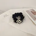 Satin scrunchie in black featuring a vintage checkered heart-shaped pendant accessory - Black Heart