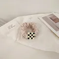 Beige scrunchie with a classic black and white checkered square charm accent - Cream Square
