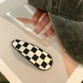 Classic black and white checkerboard drop-shaped hair clip with elegant glossy finish - Checkered / Teardrop / Black and White