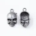 Macro shot of skull pendant front and hollow back in vintage silver alloy - Antique Pewter