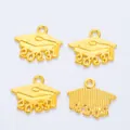 Detailed view of four golden 2023 graduation cap pendants with hanging loops for DIY jewelry - 2024 / Gold