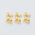 Three vintage style gold alloy rabbit charms for DIY jewelry making on grey background - Gold