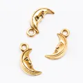Three gold vintage alloy crescent moon charms with smiling face relief for DIY jewelry - Antique Gold