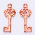 Pair of rose gold vintage alloy key pendants with floral openwork for DIY jewelry making - Rose Gold