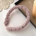 Close-up of pink purple sherpa fleece headband on a cozy vintage lace tabletop - Light Pink