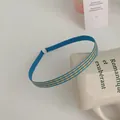 Slim blue headband with yellow stripes and fabric wrap shown on white coffee cup - Narrow Edge / Yellow and Blue Stripe