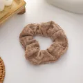 Knitted waffle texture scrunchie in warm brown color for autumn hair styling - Brown
