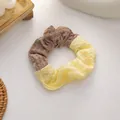 Knitted waffle scrunchie in brown and cream yellow bicolor patchwork design - Coffee and Yellow