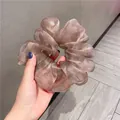 Detailed view of the oversized champagne organza scrunchie with shimmering texture - Bean Paste Color