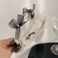 Elegant pearl headband with organza bow and rhinestone accents for a sweet feminine style - Black
