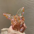 Detalle de la pinza para el pelo de mariposa de cristal con acabado champán irisado - Rosa Multicolor