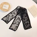 Elegant black lace hair ribbon featuring floral flocking and sheer mesh texture - Black Gauze