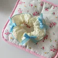 Beige lace scrunchie featuring three light blue ribbon bows in a sweet feminine style - Beige with Blue Bows (F1388 Bow)