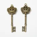 Vintage bronze alloy key pendant with a crown design for DIY jewelry and crafts - Antique Bronze