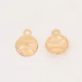 Macro shot of double-sided baseball pendant charms in vintage gold for DIY jewelry - KC Gold