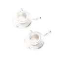 Detailed view of silver miniature teacup and saucer charms with floral embossed edges - Bright Silver