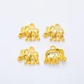 Close-up of golden elephant alloy charms for DIY jewelry making with textured details - Gold