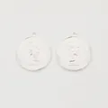 Detailed macro view of silver zinc alloy Queen Elizabeth II embossed coin charms - Bright Silver